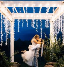 wedding kiss pergola lighting